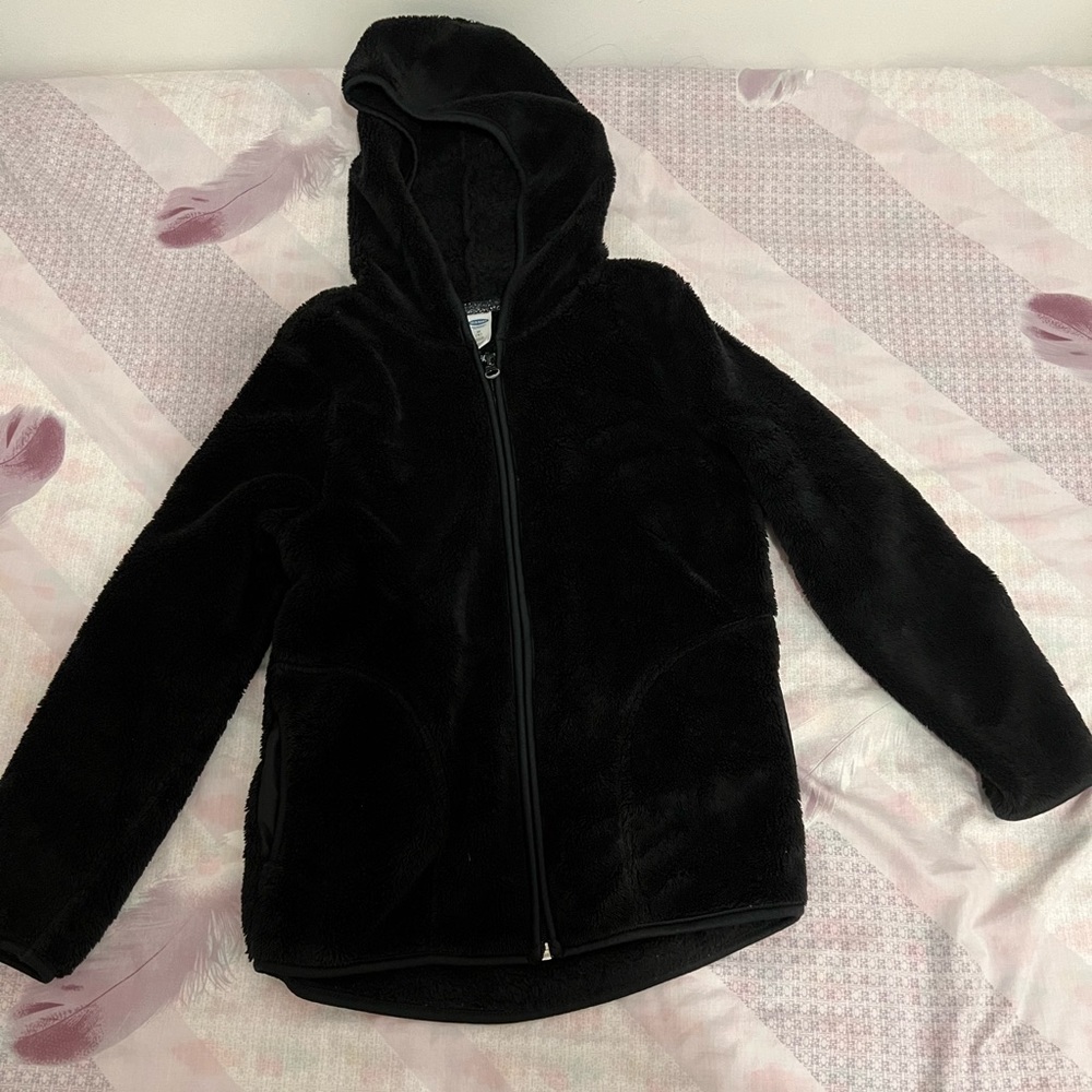 Black fuzzy sweater for an 8 year old.